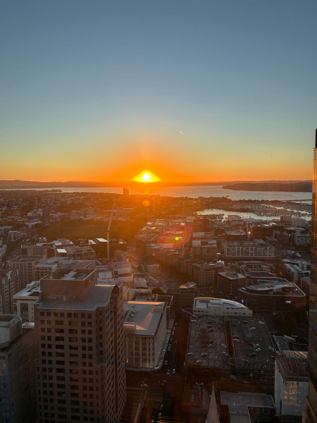 Sunset over the Waitematā Harbour from the Auckland CBD